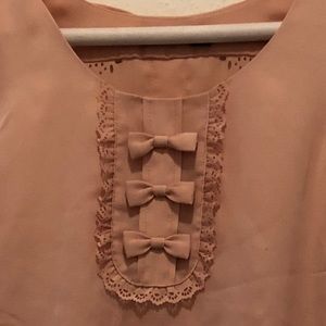 Pale pink top with bow detail